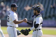 Detroit Tigers relief pitcher Michael Fulmer greets catcher Eric Hasse after saving the ninth inning of a baseball game against the Kansas City Royals, Thursday, May 13, 2021, in Detroit. (AP Photo/Carlos Osorio)