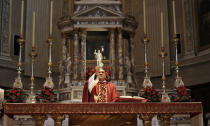 Rev. Mario Carminati celebrates Mass inside the Santissima Redentore church in Seriate, near Bergamo, Italy, Sunday, Sept. 27, 2020. As the world counts more than 1 million COVID victims, the quiet of everyday life and hum of industry has returned to Bergamo, which along with the surrounding Lombardy region was the onetime epicenter of the outbreak in Europe. But the memory of those dark winter days, and the monumental toll of dead they left behind, has remained with those who survived only to see the rest of the world fall victim, too. (AP Photo/Antonio Calanni)