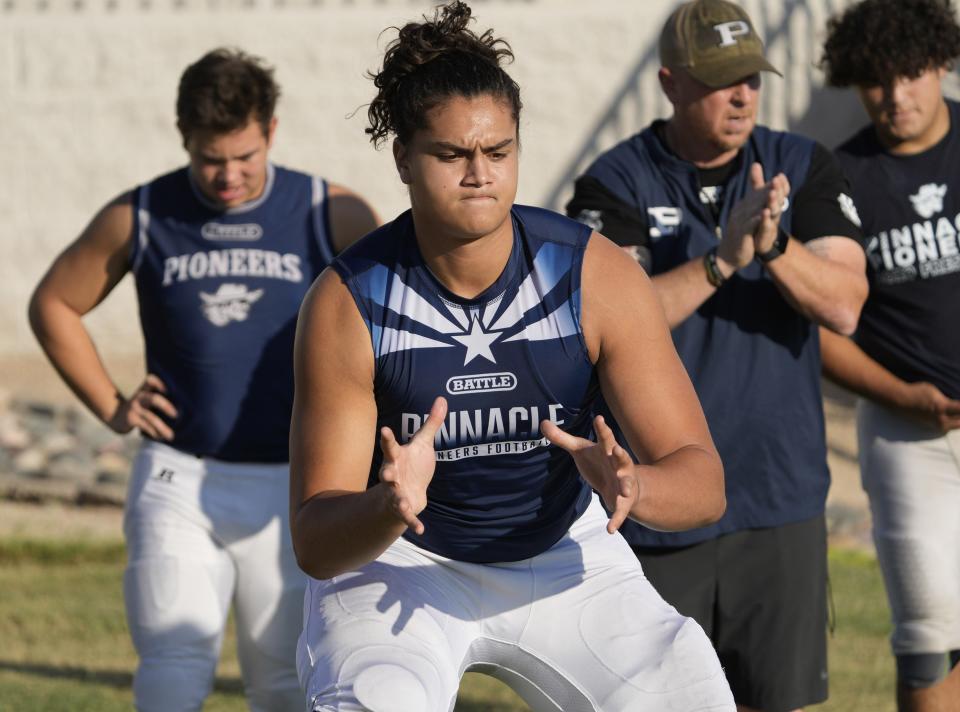 Sep 6, 2022; Phoenix, Arizona, USA;  Pinnacle OL Eli Paige performs a drill during practice at Pinnacle HS football field. Mandatory Credit: Michael Chow-Arizona Republic