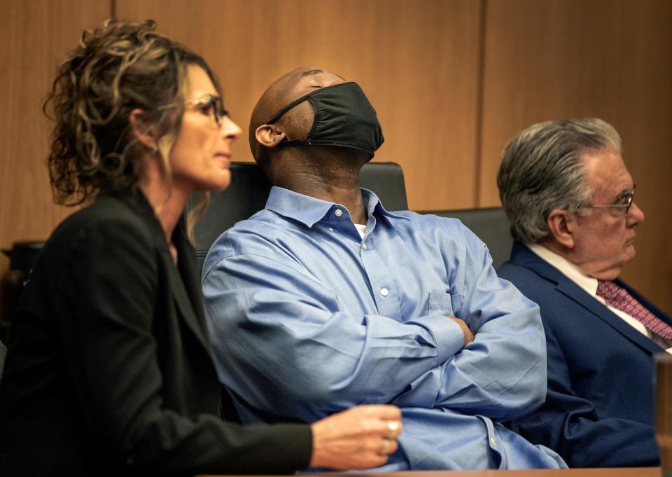 Marcelle Waldon sits between defense attorneys Debra Tuomey and Daniel Hernandez after a jury recommended the death penalty during the penalty phase of his trial in Bartow on Tuesday.