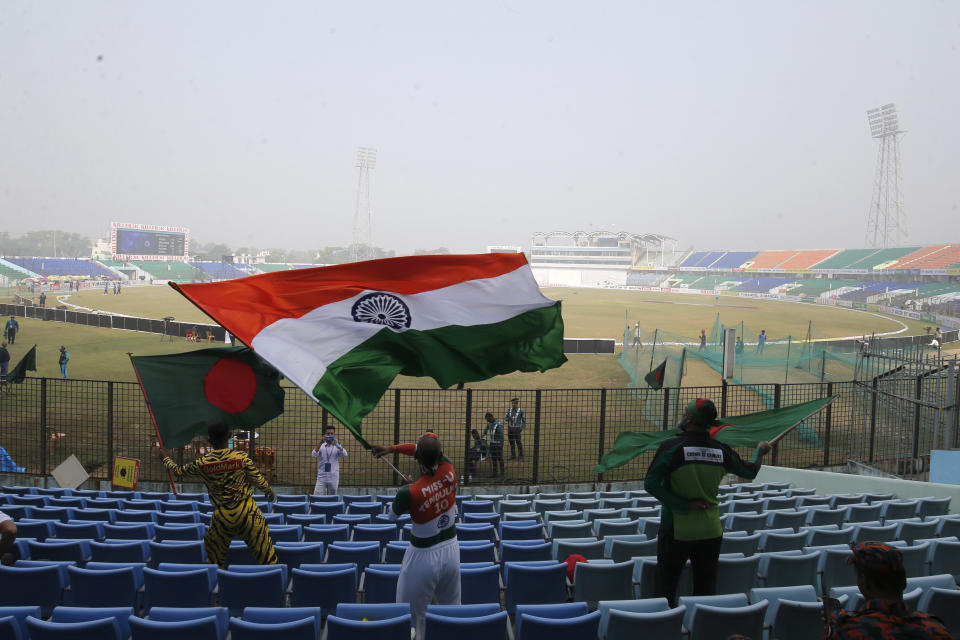 Cricket fans wave a flag during the first Test cricket match day third between Bangladesh and India in Chattogram Bangladesh, Friday, Dec. 16, 2022. (AP Photo/Surjeet Yadav)