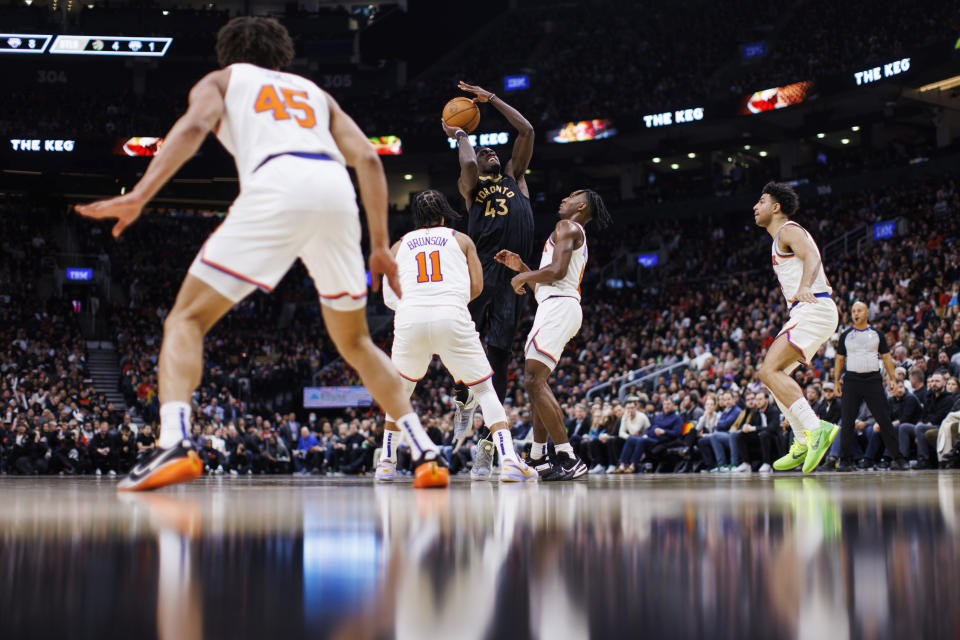 Toronto Raptors forward Pascal Siakam (43) shoots ovr New York Knicks guard Immanuel Quickley (5) during the first half of an NBA basketball game Friday, Jan. 6, 2023, in Toronto. (Cole Burston/The Canadian Press via AP)