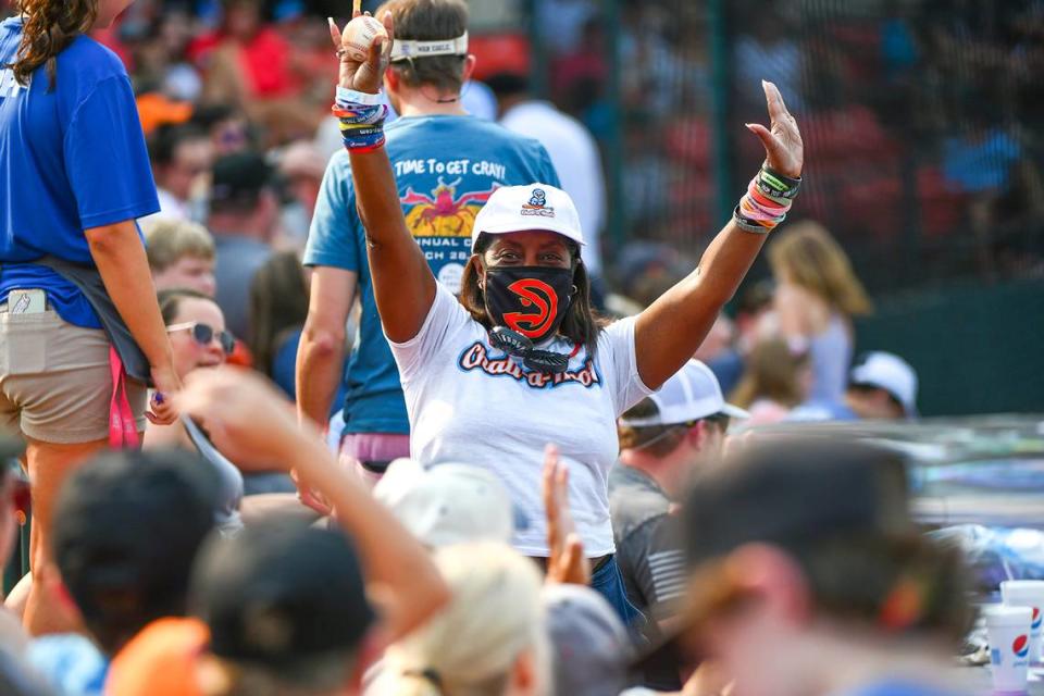 Sandra Adams celebrates her catch of a foul ball in the fifth inning of a doubleheader between the Chatt-a-Hoots and the Alpharetta Aviators Saturday afternoon, July 3, 2021. The Hoots lost both games.