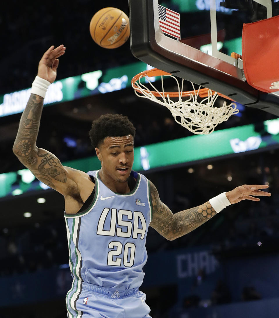 U.S. Team's John Collins, of the Atlanta Hawks misses the dunk against the World Team during the NBA All-Star Rising Stars basketball game, Friday, Feb. 15, 2019, in Charlotte, N.C. (AP Photo/Chuck Burton)