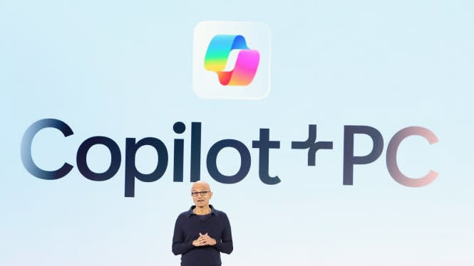  Copilot Plus slide with Satya Nadella standing in front of it onstage at Build 2024. 