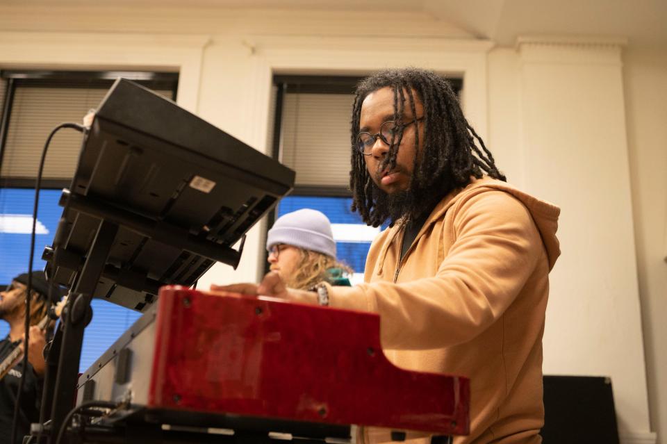 Keyboardist Danley Pyles rehearses with Minor Element at First Congregational Church in Battle Creek on Tuesday, March 30, 2023.