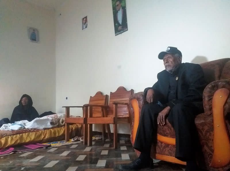 Hundeessaa Bonsa, father to the slain Ethiopian political singer Haacaaluu Hundeessaa talks during a Reuters interview, as the singer's mother Gudetu Hora looks on, at their home in Ambo