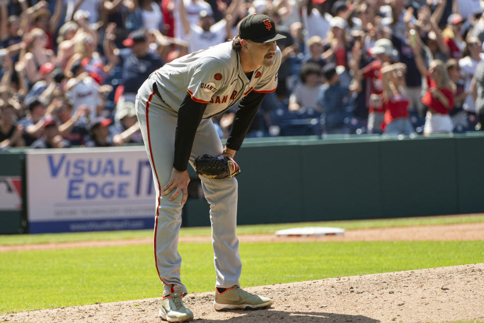 San Francisco Giants relief pitcher Sean Hjelle reacts after giving up a three-run home run to Cleveland Guardians' Bo Naylor during the sixth inning of a baseball game in Cleveland, Sunday, July 7, 2024. (AP Photo/Phil Long)