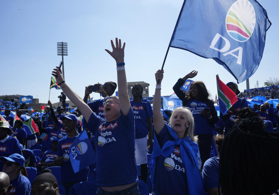 FILE - Supporters of the main opposition Democratic Alliance (DA) party attend a final election rally, in Benoni, South Africa, on May 26, 2024. In a country where racial segregation was once brutally enforced, South Africa's new coalition government has brought a Black president and a white opposition leader together in what is on the face of it a picture of unity. (AP Photo/Themba Hadebe, File)