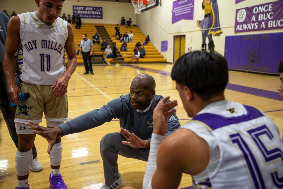 Miller head boys basketball coach Maurice Bastian speaks to the team between periods during the game against London at Miller High School on Friday, Dec. 16, 2022, in Corpus Christi, Texas.