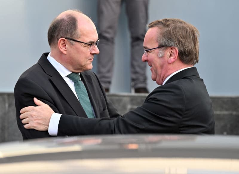 Boris Pistorius (R), German Minister of Defense, and Christian Schmidt (L), High Representative of Bosnia-Herzegovina, greet each other ahead of their meeting. Soeren Stache/dpa