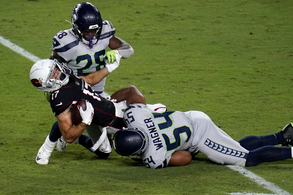 Arizona Cardinals wide receiver Andy Isabella (17) is hit by Seattle Seahawks middle linebacker Bobby Wagner (54) during the second half of an NFL football game, Sunday, Oct. 25, 2020, in Glendale, Ariz. (AP Photo/Ross D. Franklin)