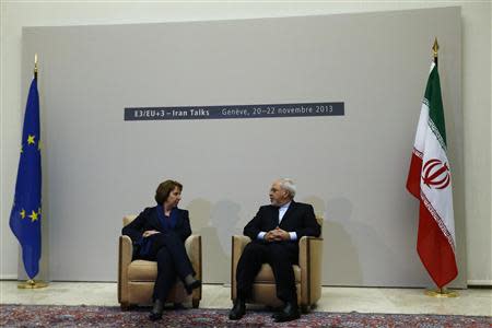 European Union foreign policy chief Catherine Ashton (L) speaks with Iranian Foreign Minister Mohammad Javad Zarif during a photo opportunity before two-day closed-door nuclear talks at the United Nations European headquarters in Geneva November 20, 2013. REUTERS/Denis Balibouse