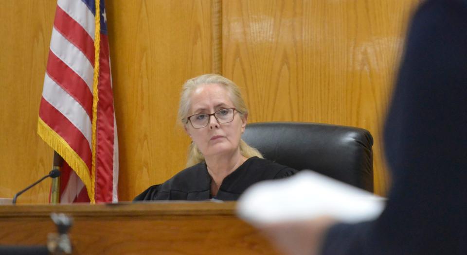 Falmouth District Court Judge Lisa Edmonds listens on Tuesday to a prosecutor during the arraignment of Adrian Black, 22, of Taunton on charges related to the stabbing death of Milteer Hendricks, 19, of Falmouth