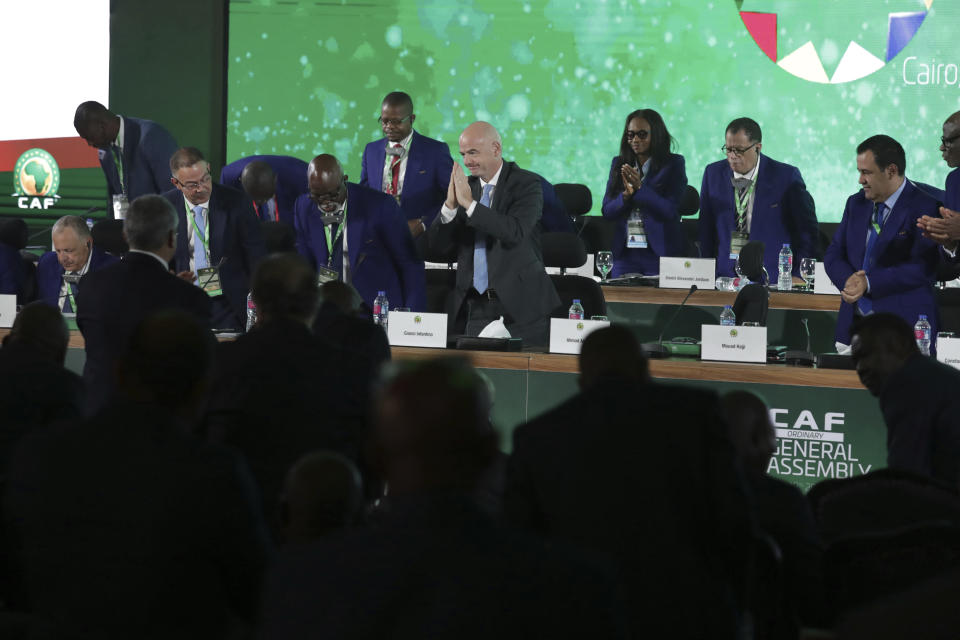 FIFA president Gianni Infantino greets delegates during the Confederation of African Football general assembly in Cairo, Egypt, Thursday, July 18, 2019. The African soccer body is holding its first major meeting since announcing that FIFA will send a senior official to lead a clean-up of the scandal-plagued organization in an unprecedented move for soccer. The Confederation of African Football, whose president is facing numerous allegations of corruption amid the crisis, is holding its general assembly on Thursday in Cairo on the eve of the African Cup final. (AP Photo/Hassan Ammar)