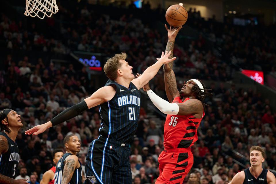 Oct 27, 2023; Portland, Oregon, USA; Portland Trail Blazers center Robert Williams III (35) shoots a basket during the first half against Orlando Magic center Moritz Wagner (21) at Moda Center. Mandatory Credit: Troy Wayrynen-USA TODAY Sports