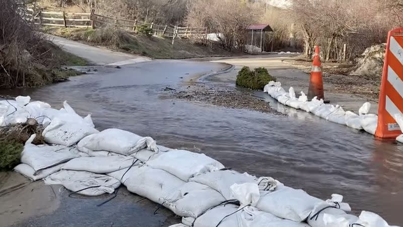 Emigration Creek floodwaters are diverted in Emigration Canyon in Salt Lake County on Sunday evening.