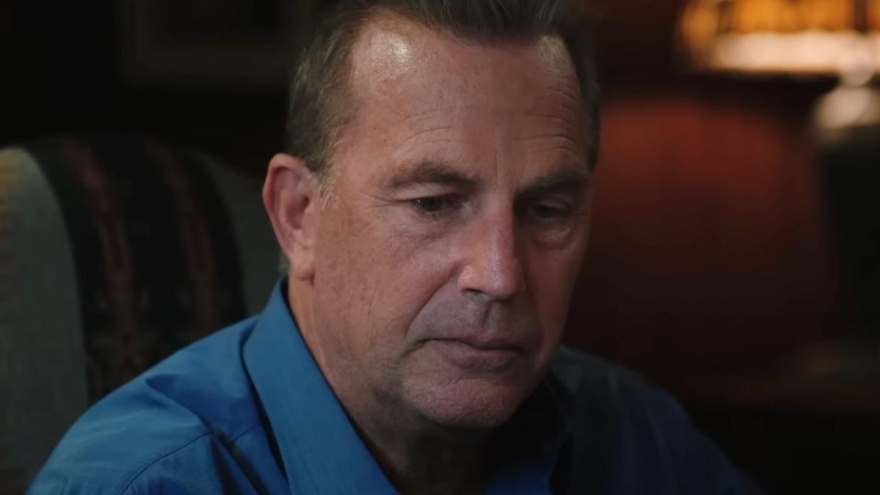  A screenshot of Kevin Costner as John Dutton sitting at the dining room table in Yellowstone. 