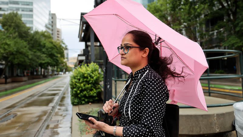Raunak Sharma walks in the rain in downtown Salt Lake City on Tuesday, Aug. 22, 2023.