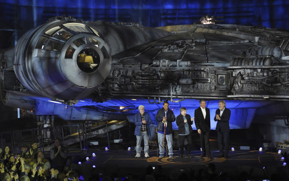 From left, "Star Wars" film franchise creator George Lucas, cast members Billy Dee Williams and Mark Hamill, Walt Disney Co. Chairman and CEO Bob Iger and cast member Harrison Ford stand in front of the Millennium Falcon starship during a dedication ceremony for the new Star Wars: Galaxy's Edge attraction at Disneyland Park, Wednesday, May 29, 2019, in Anaheim, Calif. (Photo by Chris Pizzello/Invision/AP)