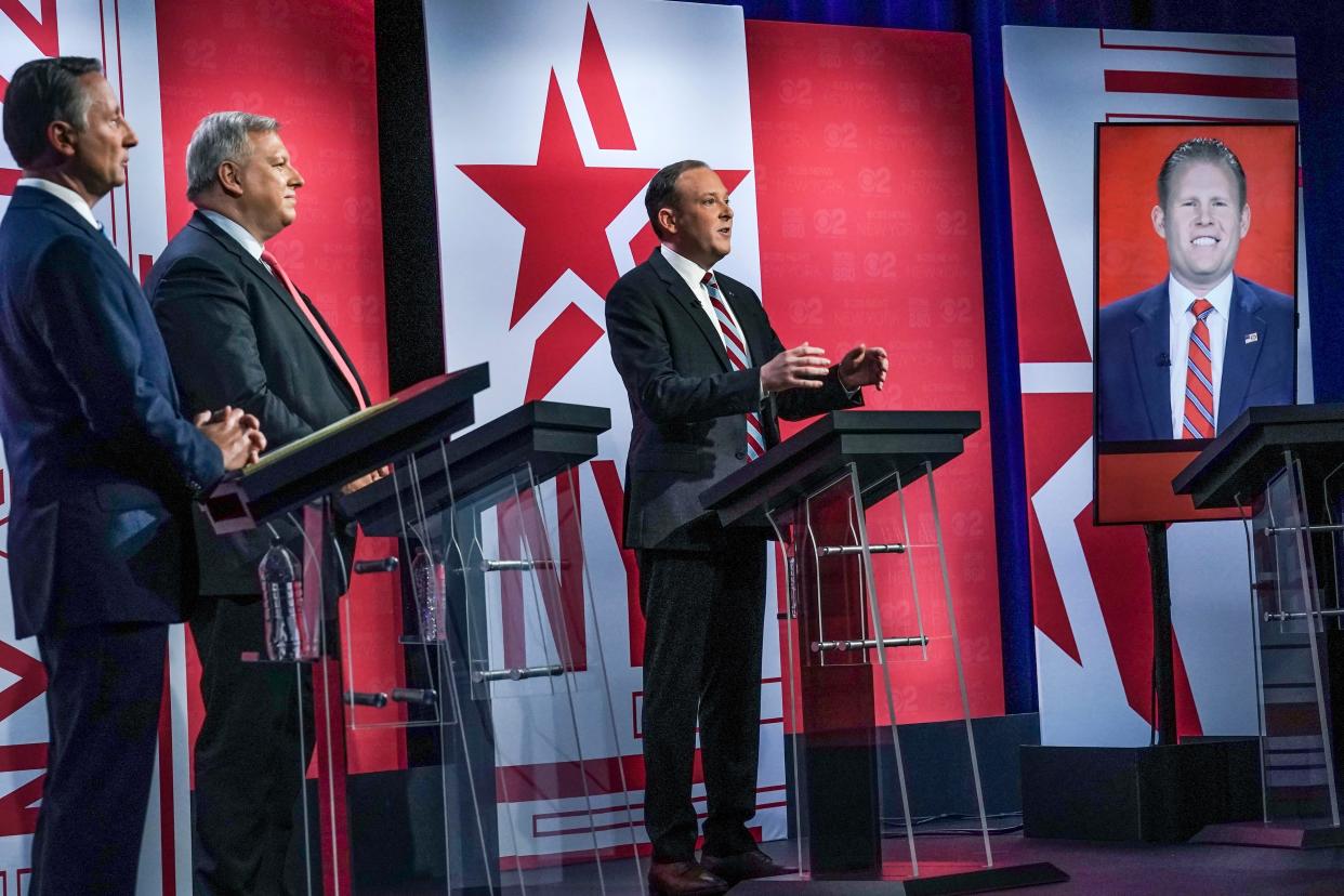 Former Westchester County Executive Rob Astorino, far left, businessman Harry Wilson, second from left, Suffolk County Congressman Lee Zeldin, second from right, and Andrew Giuliani, far right, son of former New York City Mayor Rudy Giuliani, face off during New York's Republican gubernatorial debate at the studios of CBS2 TV, Monday, June 13, 2022, in New York. Giuliani participated via virtual broadcast after he was blocked from the studios for not meeting vaccine requirements. 