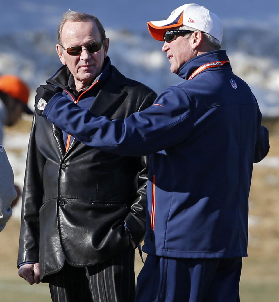 Denver Broncos coach John Fox, right, talks to owner Pat Bowlen during practice for the football team's NFL playoff game against the San Diego Chargers at the Broncos training facility in Englewood, Colo., on Wednesday, Jan. 8, 2014. AP Photo/Ed Andrieski)