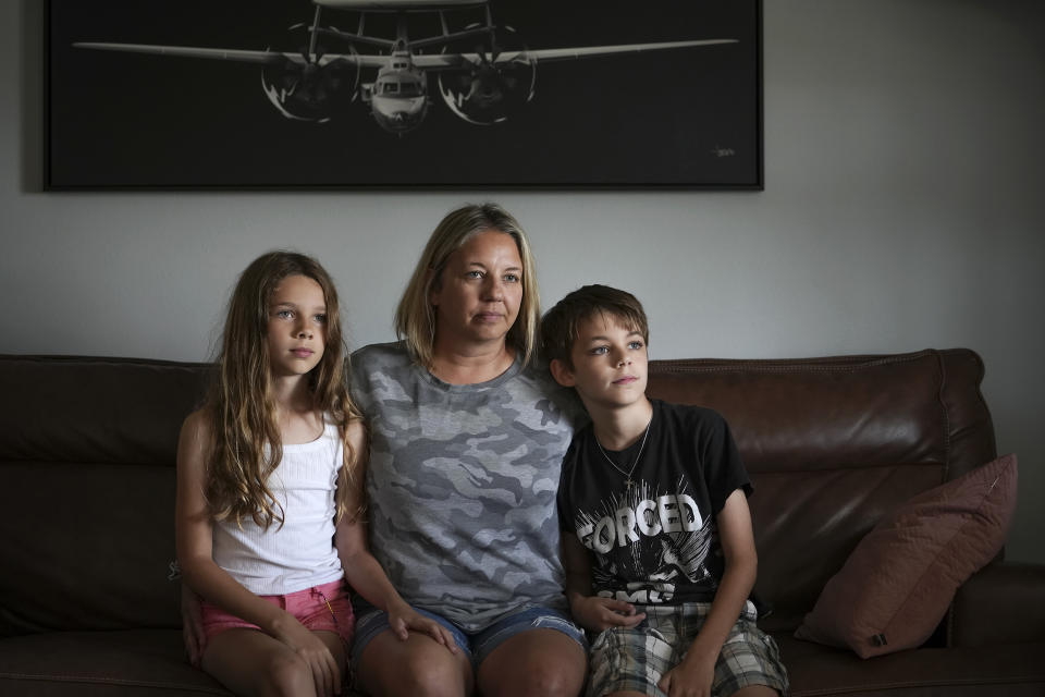 Kim Hough sits with her children, Emelia and Ethan. (Jacob M. Langston for NBC News)