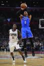 Oklahoma City Thunder guard Russell Westbrook, right, shoots as Los Angeles Clippers guard Jamal Crawford defends during the second half of an NBA basketball game, Monday, Jan. 16, 2017, in Los Angeles. The Clippers won 120-98. (AP Photo/Mark J. Terrill)