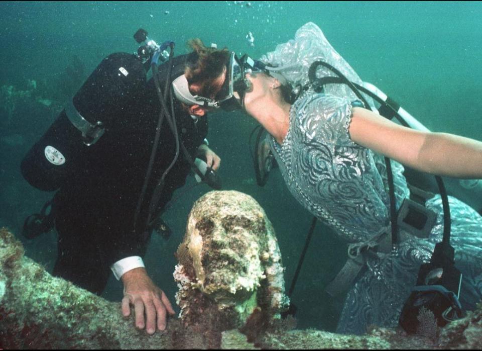 There wasn't a dry eye in the house during the underwater wedding of Bob Woodberry and Emily Johnson in the Florida Keys on Aug. 22, 1998. The lovebirds dove into holy matrimony in the depths of Key Largo, right next to a bronze 'Christ of the Deep' statue. Amen to that. 