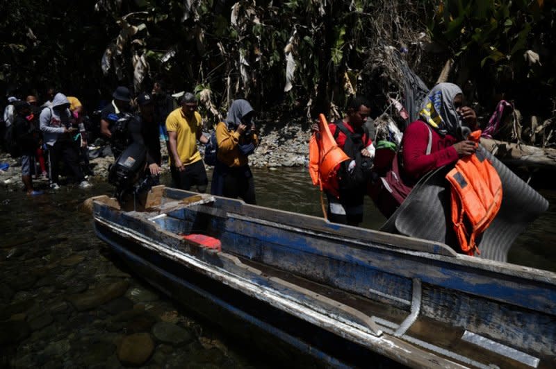 Migrants wait in the jungle to be transferred by canoe from Quebrada Leon to the community of Bajo Chiquito, Panama, on March 10. File Photo by Bienvenido Velasco/EPA-EFE