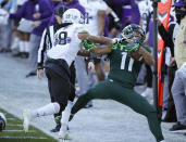 Michigan State's Connor Heyward, right, is pushed out of bounds by Northwestern's Cameron Ruiz during the first half of an NCAA college football game, Saturday, Nov. 28, 2020, in East Lansing, Mich. (AP Photo/Al Goldis)