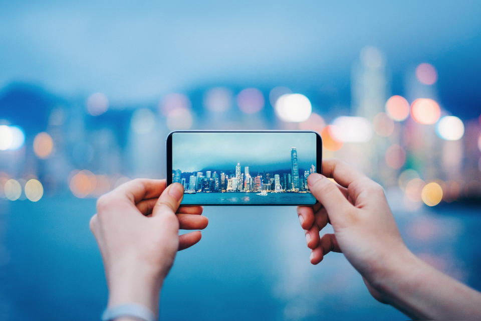 Capturing the iconic city skyline of Hong Kong by the Victoria Harbour during sunset