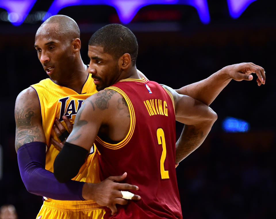 LOS ANGELES, CA - MARCH 10:  Kobe Bryant #24 of the Los Angeles Lakers gueards Kyrie Irving #2 of the Cleveland Cavaliers during a 120-108 Cavaliers win at Staples Center on March 10, 2016 in Los Angeles, California.  NOTE TO USER: User expressly acknowledges and agrees that, by downloading and or using this Photograph, user is consenting to the terms and condition of the Getty Images License Agreement.  (Photo by Harry How/Getty Images)