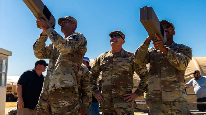 Maj. Gen. Phil Brooks, Fires Center of Excellence and Fort Sill commanding general, center, observes as to students practice disabling UAVs during training at Fort Sill's new Joint Counter-small Unmanned Aircraft Systems (C-sUAS) University (JCU).
