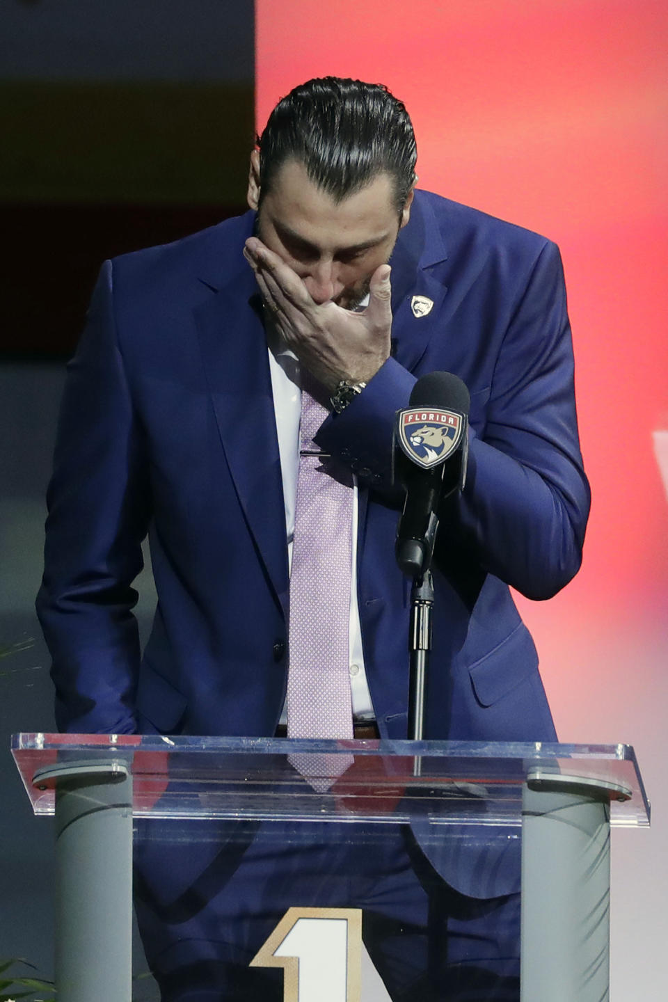 Former Florida Panthers goalie Roberto Luongo pauses as he speaks to fans about his family, before his jersey is hoisted to the rafters during a ceremony before an NHL hockey game against the Montreal Canadiens, Saturday, March 7, 2020, in Sunrise, Fla. (AP Photo/Wilfredo Lee)