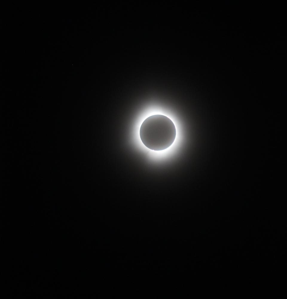 This photo taken by the author of this column, Dan Cherry, on April 8, 2024, shows not only the total solar eclipse as seen from Port Clinton, Ohio, but small solar plumes erupting from the sun at the time.