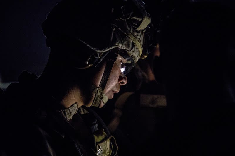 U.S. Marines assigned to Special Purpose Marine Air-Ground Task Force-Crisis Response-Central Command 19.2 prepare to deploy to reinforce Baghdad's U.S. embassy from a base in Kuwait
