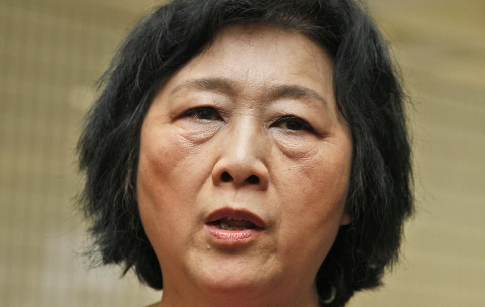 In this June 9, 2012 photo, Chinese journalist Gao Yu, who was imprisoned for nearly 6 year in the 1990s on charges of leaking state secrets, attends an opening ceremony of Chinese artist Liu Xia's photo exhibition in Hong Kong. Prominent Chinese journalist Gao Yu has been "criminally detained" just weeks ahead of the 25th anniversary of the Tiananmen Square crackdown for allegedly leaking state secrets to a foreign news site, the state news agency Xinhua reported Thursday, May 8, 2014. (AP Photo/Kin Cheung)