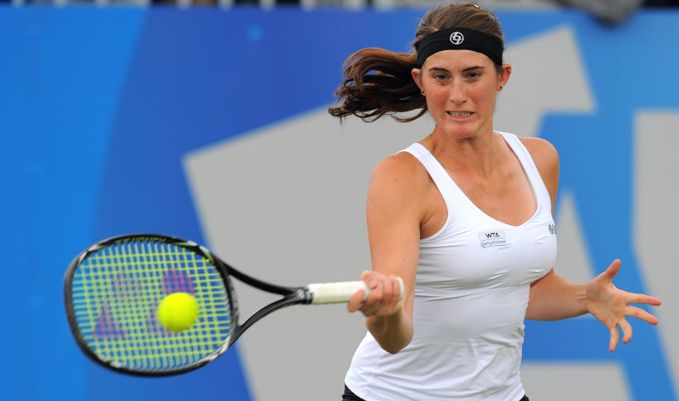 Canada's Rebecca Marino returns to Serbia's Ana Ivanovic at Birmingham in June, 2011. (ANDREW YATES/AFP/Getty Images)