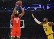 February 21, 2019; Los Angeles, CA, USA; Houston Rockets guard James Harden (13) shoots against Los Angeles Lakers forward LeBron James (23) during the first half at Staples Center. Mandatory Credit: Gary A. Vasquez-USA TODAY Sports