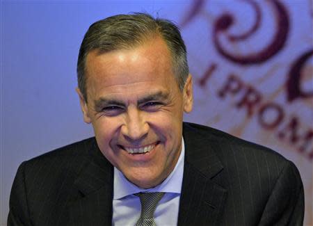 Bank of England Governor Mark Carney smiles during the bank's quarterly inflation report news conference at the Bank of England in London November 13, 2013. REUTERS/Toby Melville