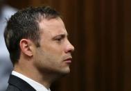 Olympic and Paralympic track star Oscar Pistorius listens to the verdict in his trial at the high court in Pretoria September 12, 2014. REUTERS/Siphiwe Sibeko