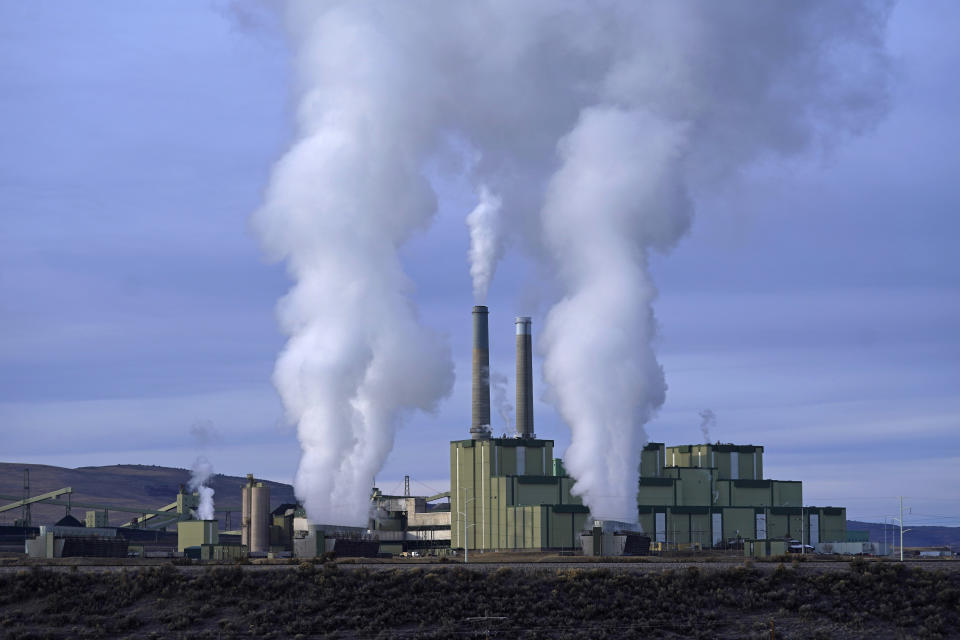 Steam billows from the Craig Power Plant on Thursday, Nov. 18, 2021, in Craig, Colo. The town in northwest Colorado is losing its coal plant, and residents fear it is the beginning of the end for their community. (AP Photo/Rick Bowmer)