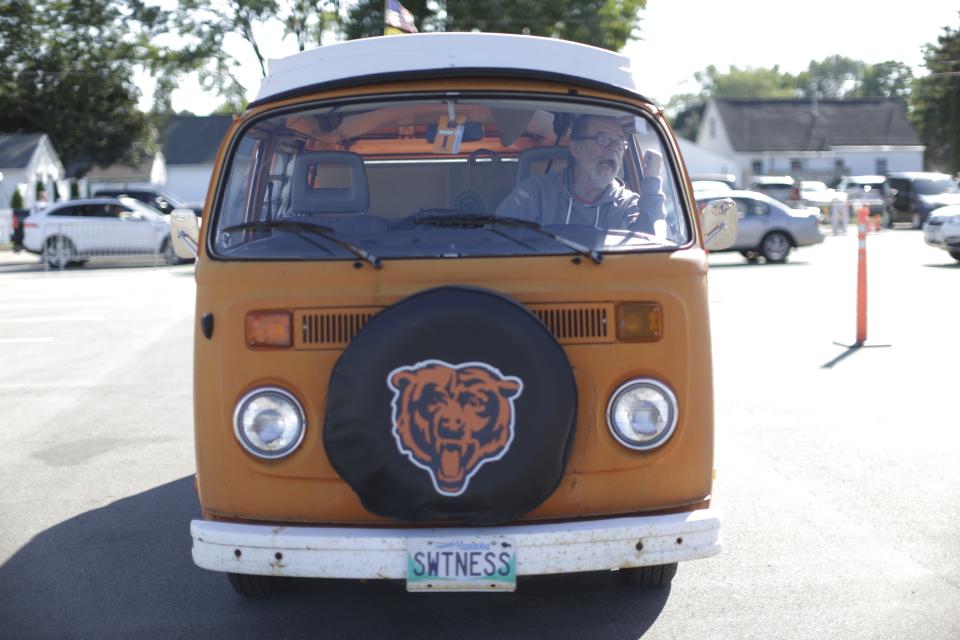 A Chicago Bears fan drives into a parking lot near Lambeau Field before an NFL football game against the Green Bay Packers Sunday, Sept. 9, 2018, in Green Bay, Wis. (AP Photo/Jeffrey Phelps)