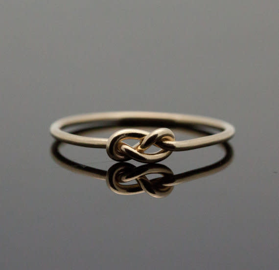 <small><a href="https://www.etsy.com/listing/93179081/gold-infinity-ring-solid-14k-gold-knot?utm_source=google&utm_medium=product_listing_promoted&utm_campaign=jewelry-ring-mid&gclid=CjwKEAjwjN2eBRDbyPWl0JLY5lYSJACPo0UipI9a8ks5CH9-s7y8IYqE9Zyu3U-oPzbvKVRqJgVkCRo%3C/span%3E%3C/div%3E%3Cdiv%20class=" target="_blank">IndulgentDesigns</a> via Etsy </small> <br> 14k gold knot, $121   