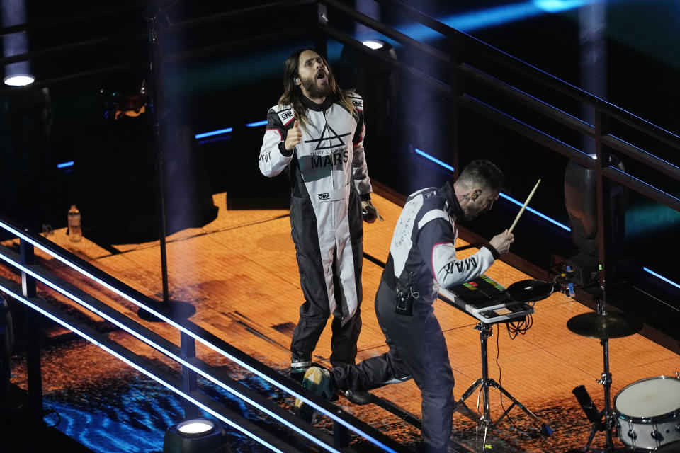 Jared Leto, left, performs with Thirty Seconds to Mars during an opening ceremony for the Formula One Las Vegas Grand Prix auto race, Wednesday, Nov. 15, 2023, in Las Vegas. (AP Photo/Darron Cummings)