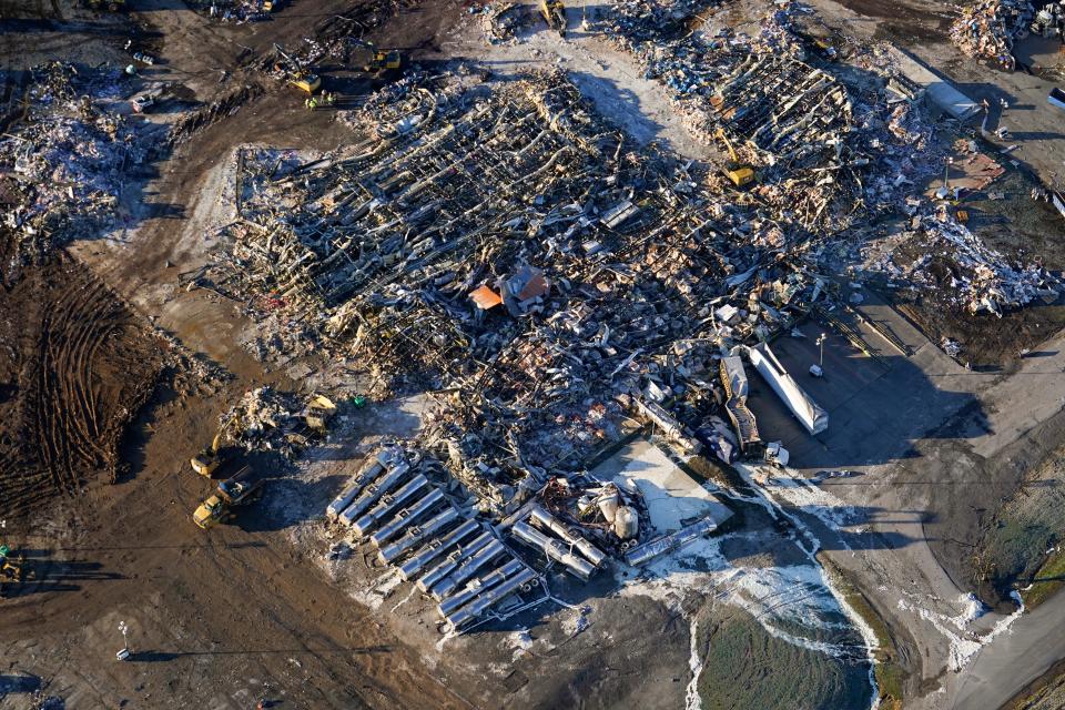 In this aerial photo, a collapsed factory is seen in Mayfield, Ky., Sunday, Dec. 12, 2021. Tornadoes and severe weather caused catastrophic damage across multiple states Friday, killing several people overnight. (AP Photo/Gerald Herbert)