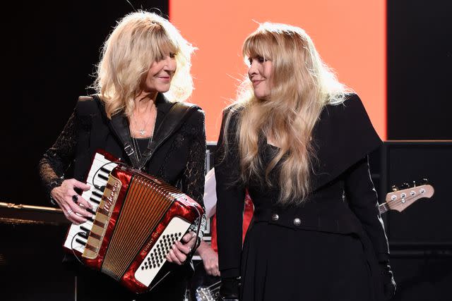 <p>Kevin Mazur/Getty</p> Fleetwood Mac bandmates and friends Stevie Nicks and Christine McVie performing together in 2018.