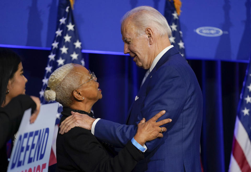 FILE - President Joe Biden talks to people on stage after speaking about abortion access during a Democratic National Committee event at the Howard Theatre, Oct. 18, 2022, in Washington. (AP Photo/Evan Vucci, File)