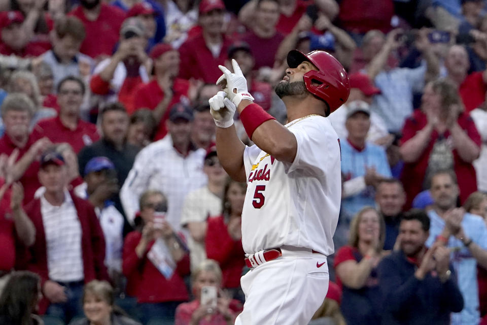 St. Louis Cardinals' Albert Pujols celebrates after hitting a solo home run during the first inning of a baseball game against the Kansas City Royals Tuesday, April 12, 2022, in St. Louis. (AP Photo/Jeff Roberson)